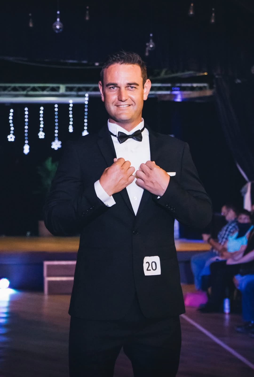 Deon Lensing wearing formal evening attire at a pageant event